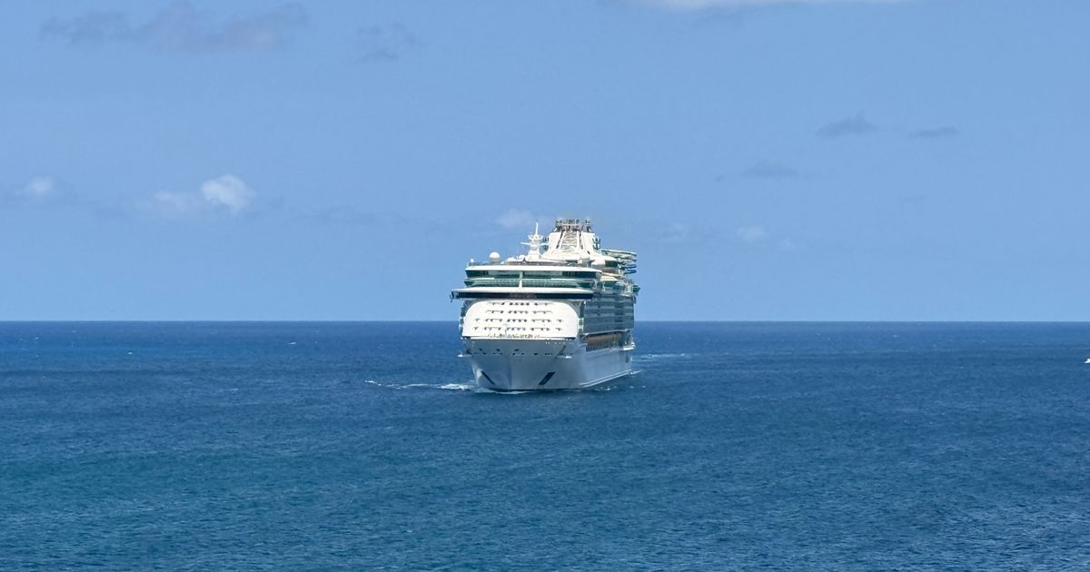 Cruise ship sailing the Caribbean under a clear blue sky