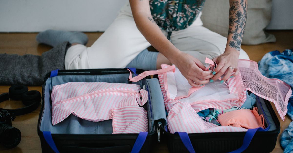 Packing a suitcase before flying to Florida